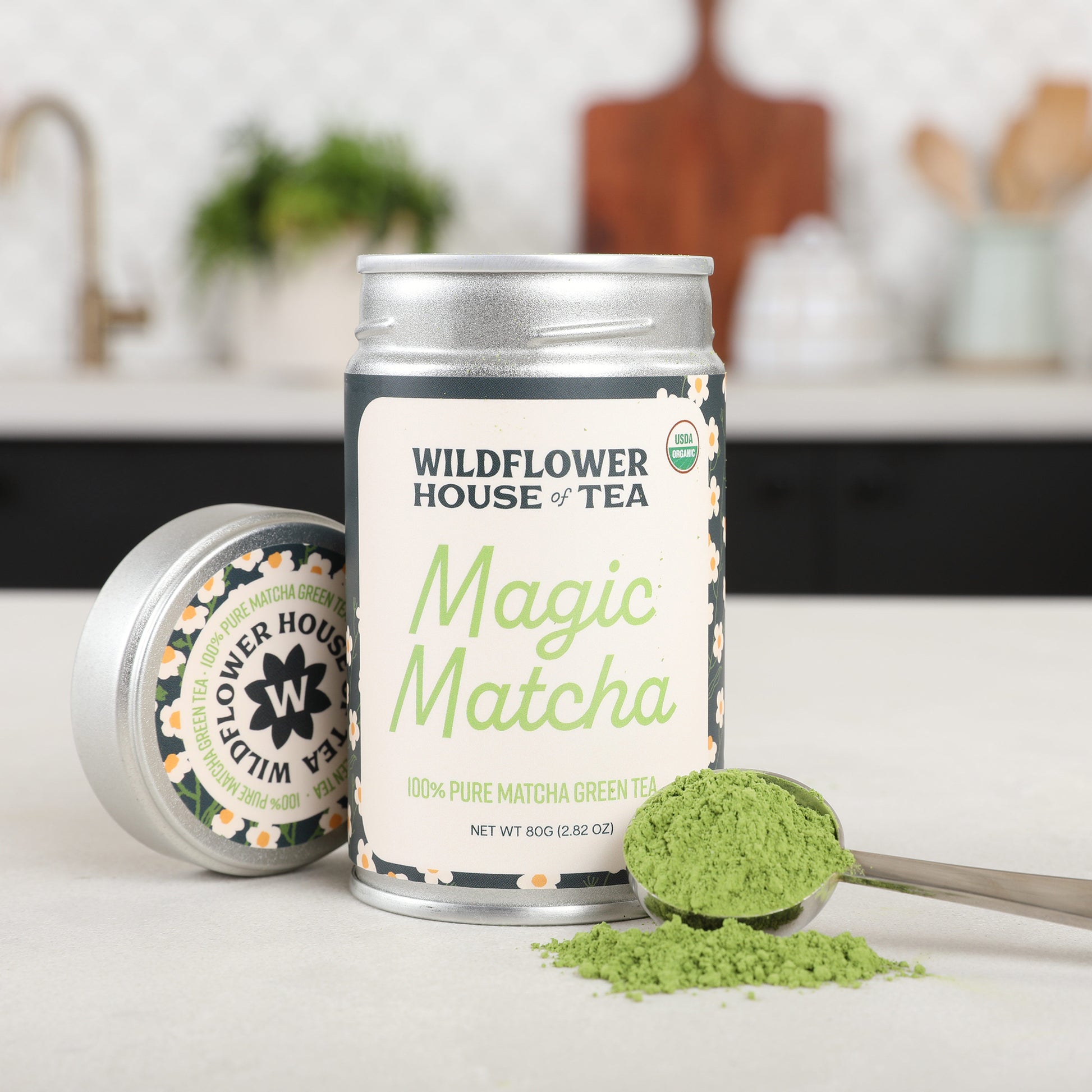 Matcha can opened with matcha powder on spoon