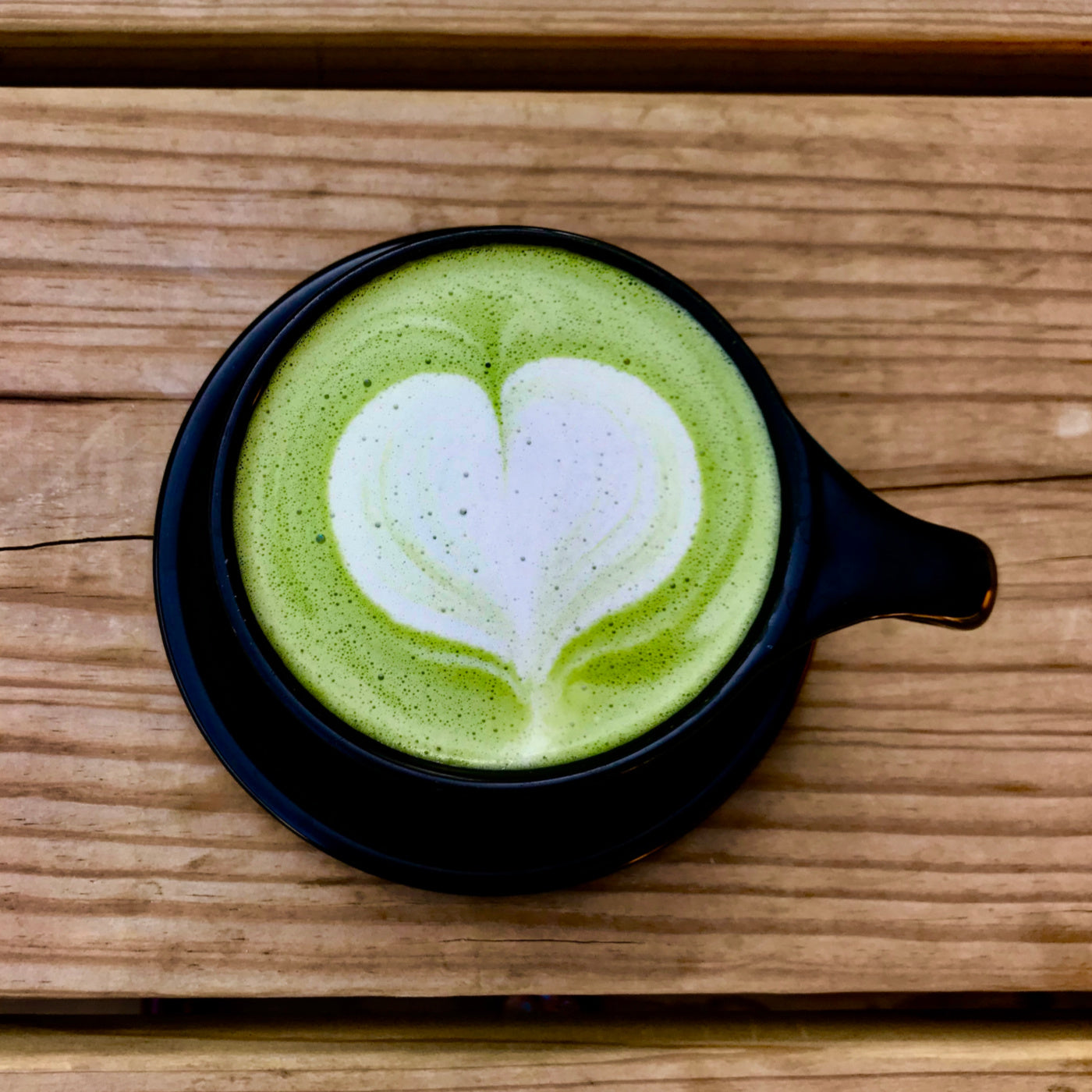 Matcha drink with heart shaped matcha art